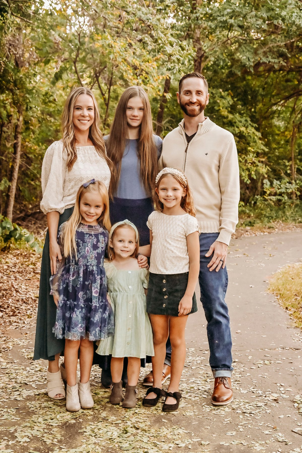 Alexander Hewitt with his wife and four daughters, outdoors
